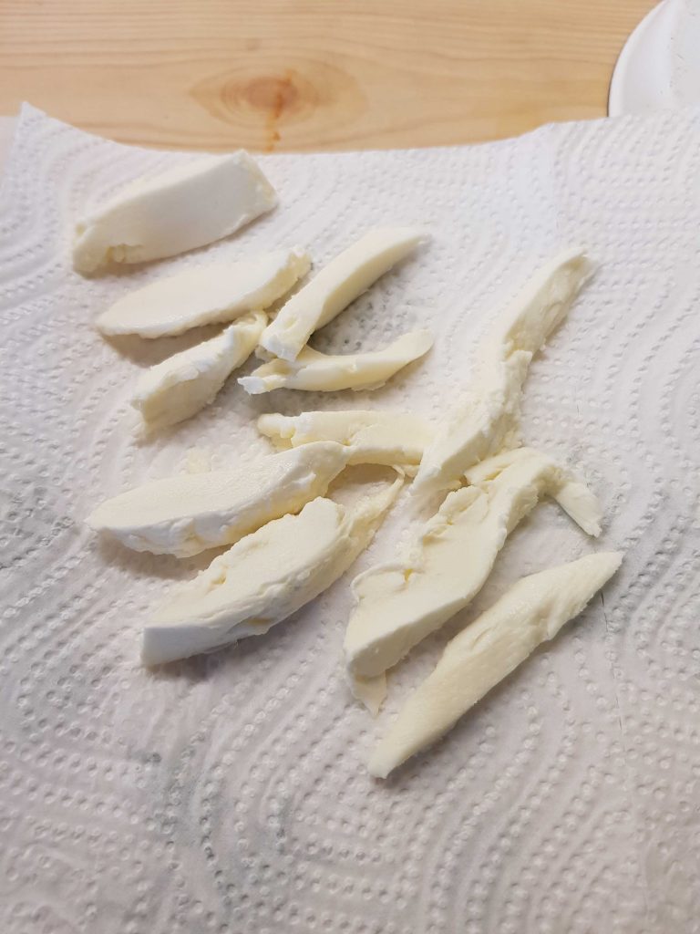 Dry mozzarella cheese on paper towel