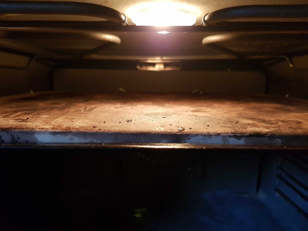 Pizza stone on top rack of the oven