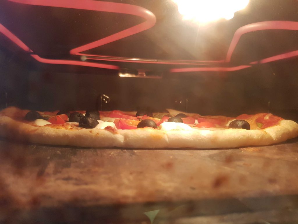 Pizza under broiler