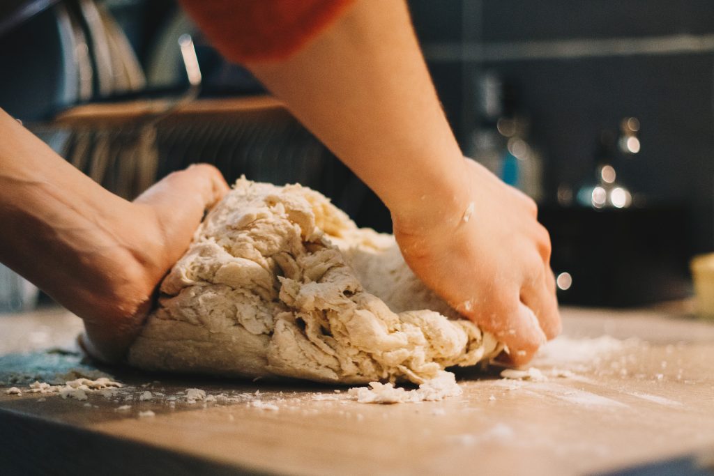 kneading pizza dough