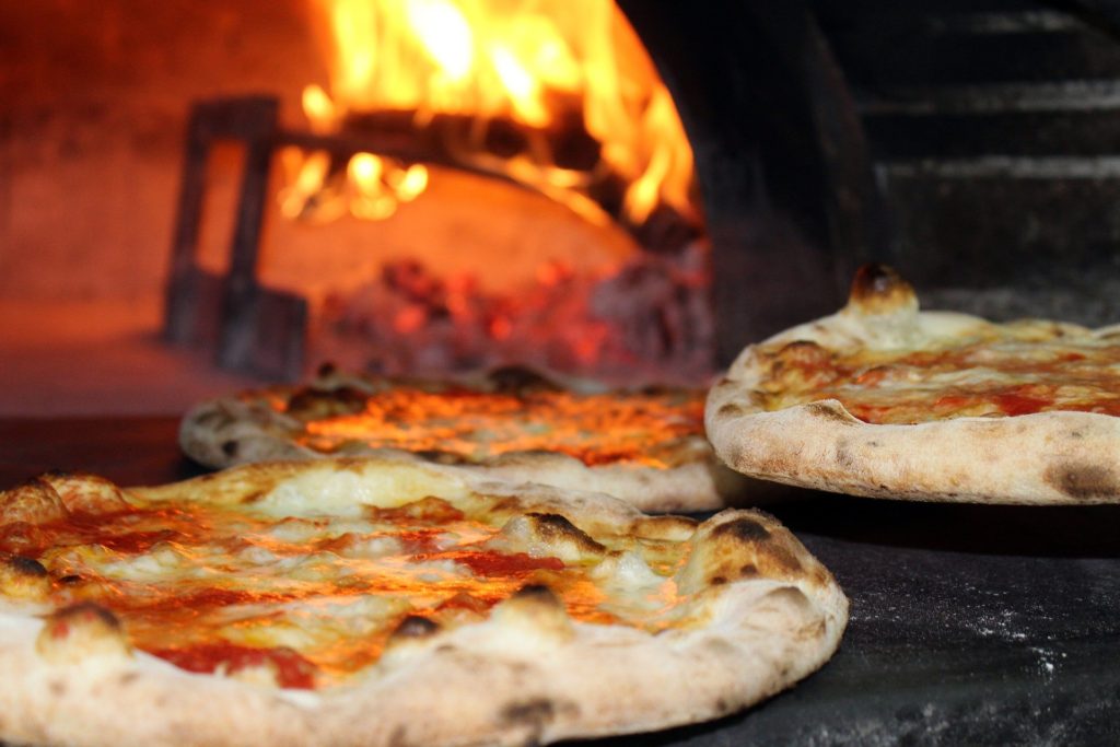 Pizza in wood-fired pizza oven