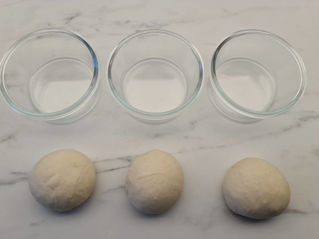 Three pizza dough and pizza dough ball containers