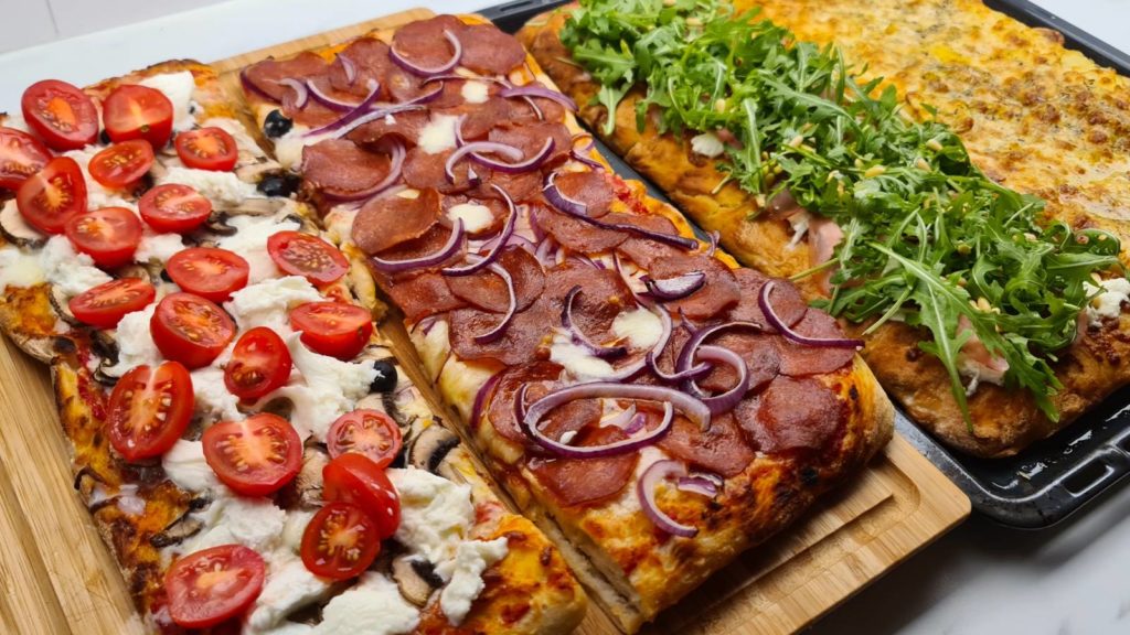 Four different homemade Pizza al taglio