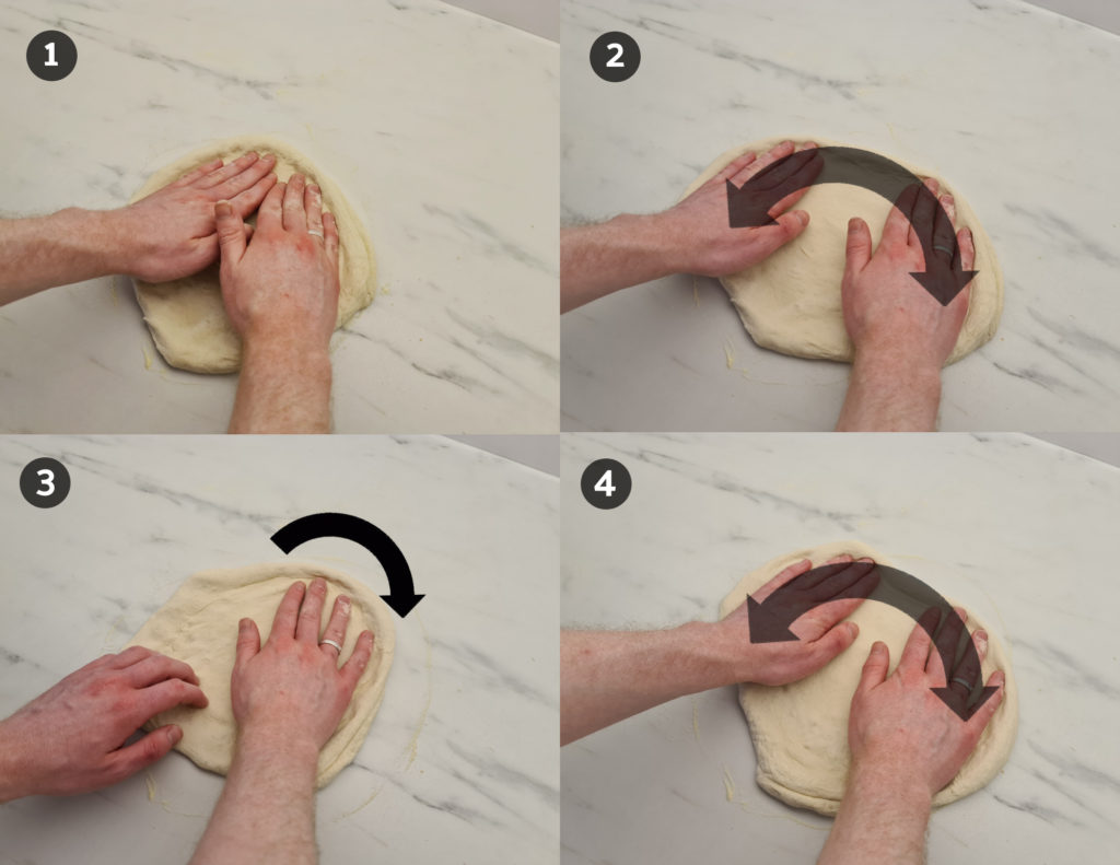 Stretching pizza dough by rotating and stretching the dough outwards using flat hands